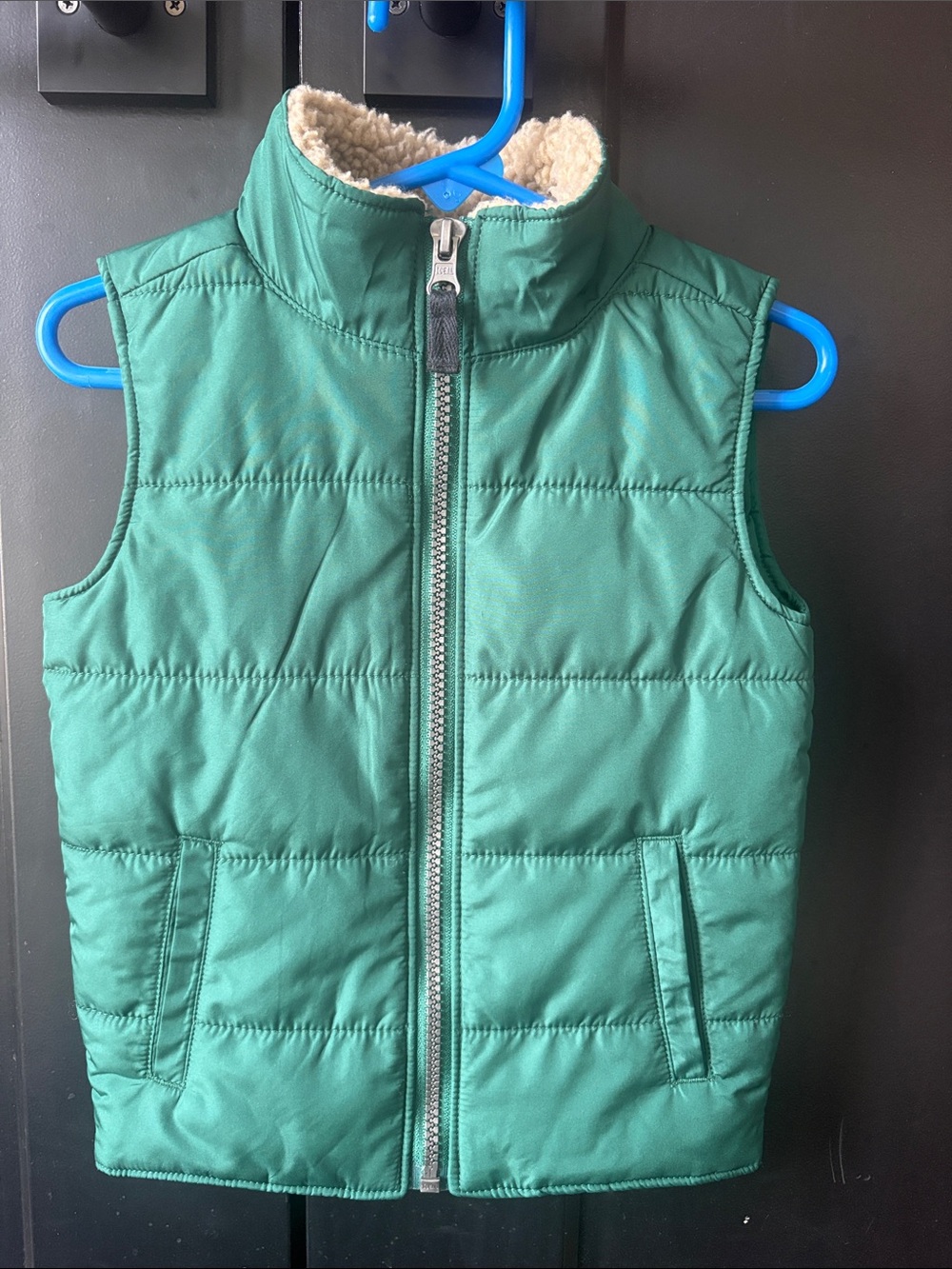 Carter’Kids Green Puffer Vest with Sherpa Lining.